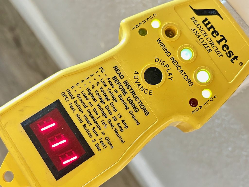 SureTest circuit analyzer showing voltage and wiring indicators during a home inspection in Oceanside, California.